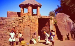 Gate of Ambohimanga in Madagascar. The megalithic stone disc - door is visible