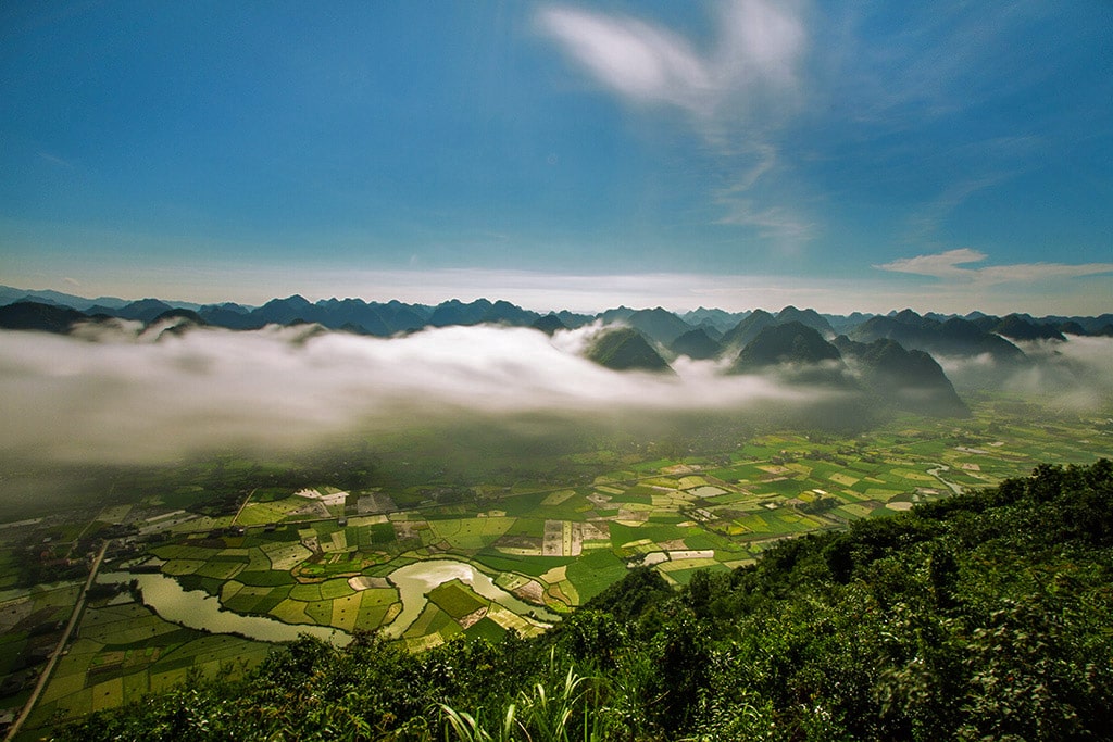 Early morning and fog over a valley in Bắc Son, Vietnam