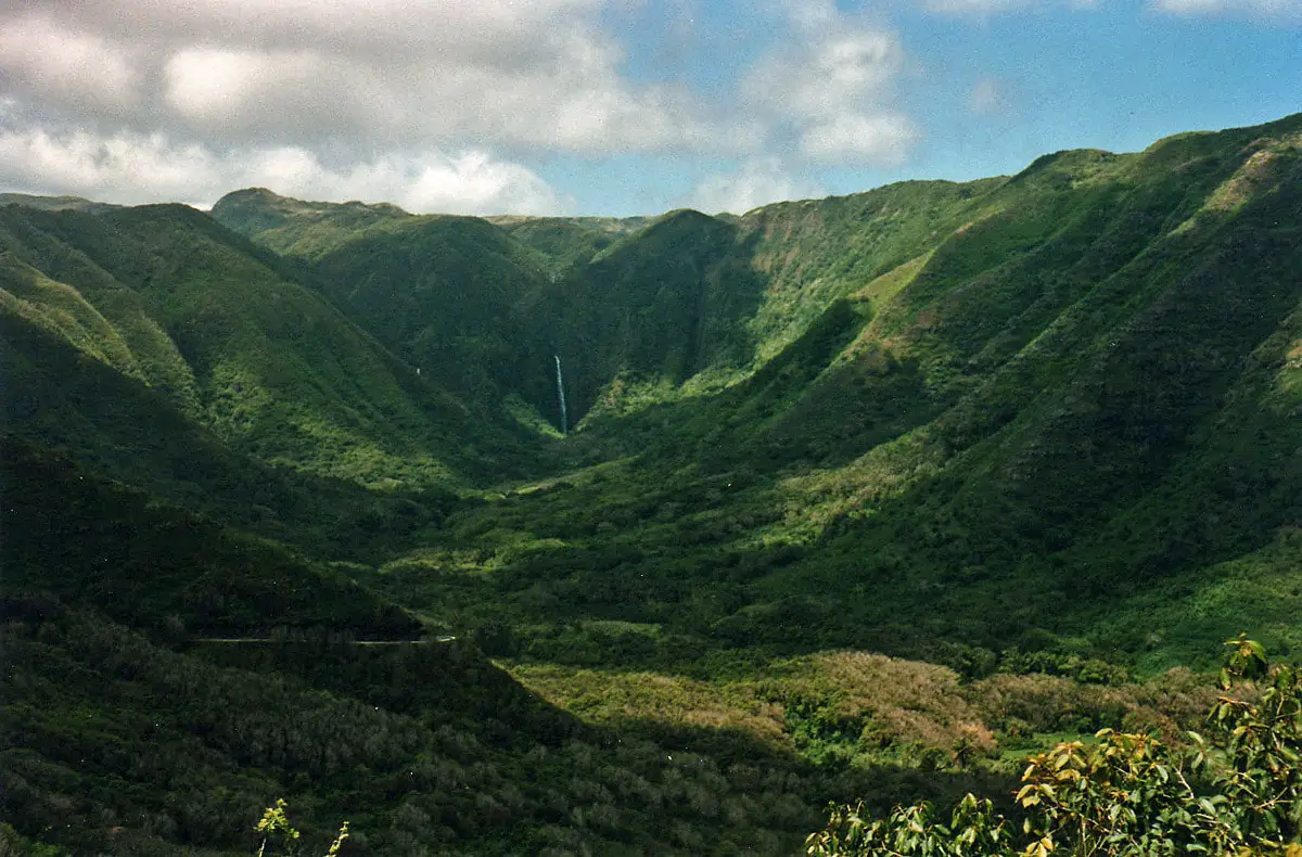 Halawa Valley and Hipuapua Falls. It is possible that white spot to the left from falls is a spot of Moa'ula Falls