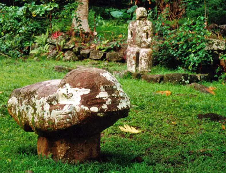 Me'ae Iipona, Maki'i Taua Pepe sculpture in the foreground, Marquesas Islands