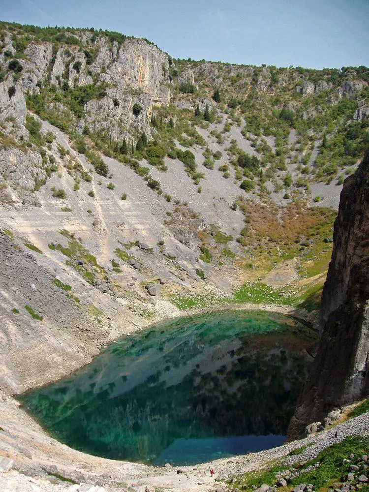 Modro Jezero in Croatia. Note the person below, in the forefront. There are seen also traces of much higher water levels