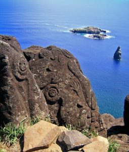 Orongo petroglyphs with Motu Nui islands in the background, Rapa Nui
