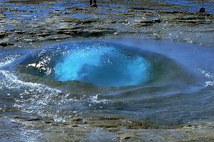 The famous bubble of Strokkur is rising, Iceland