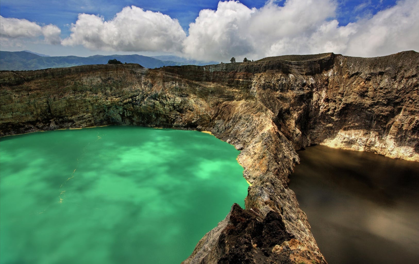  Kelimutu  volcano with differently colored crater lakes 