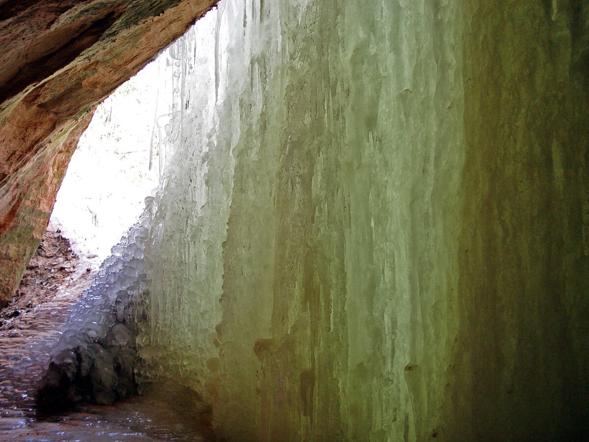 Behind the ice curtain of Kraulukalns Ice Grotto, March 2003