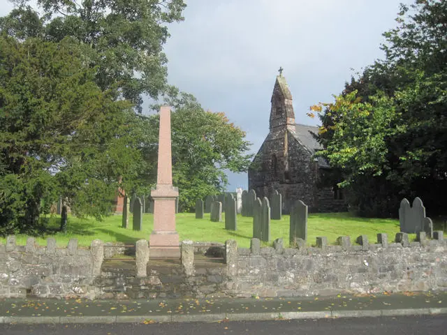 St Erfyl's Church with the war memorial in the forefront. Branches of Llanerfyl Yew are seen in the right side.